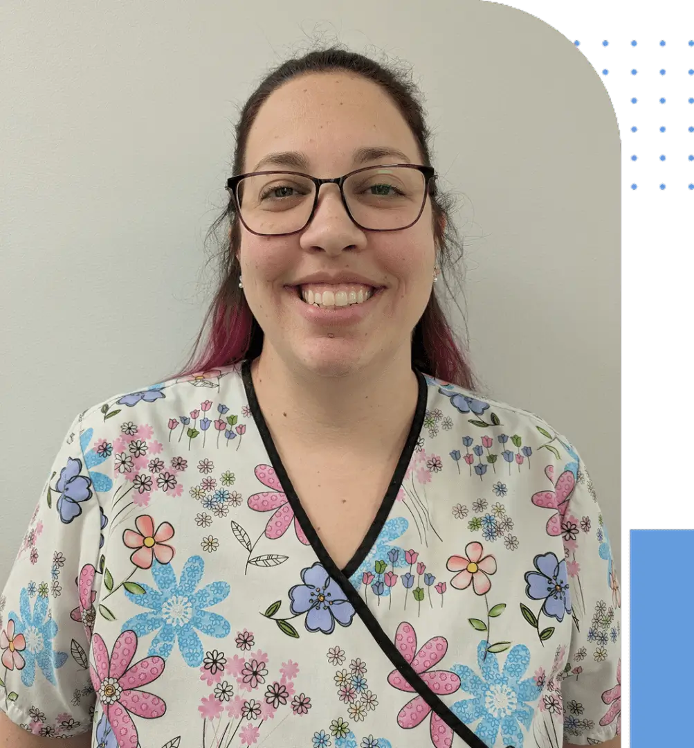 Smiling woman in floral medical scrubs